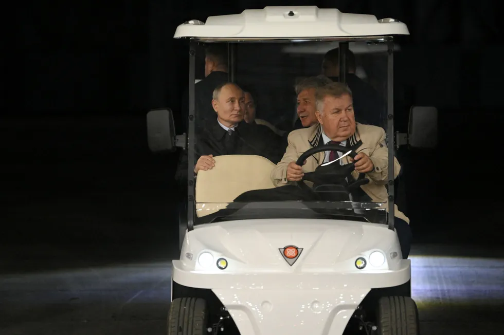 Russian President Vladimir Putin (left), accompanied by Novatek executive chairman Leonid Mikhelson (right behind the driver), during a visit to Novatek’s LNG construction yard near Murmansk in July 2023.