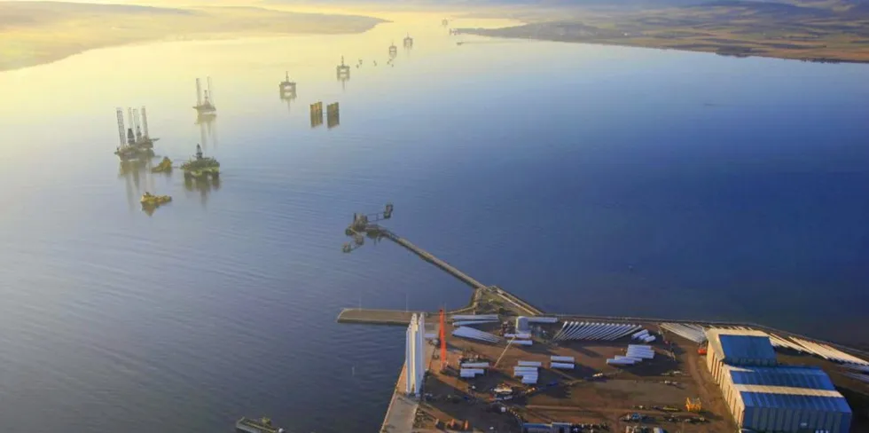 Nigg yard, with stacked oil & gas drill rigs, in the Scottish Highlands