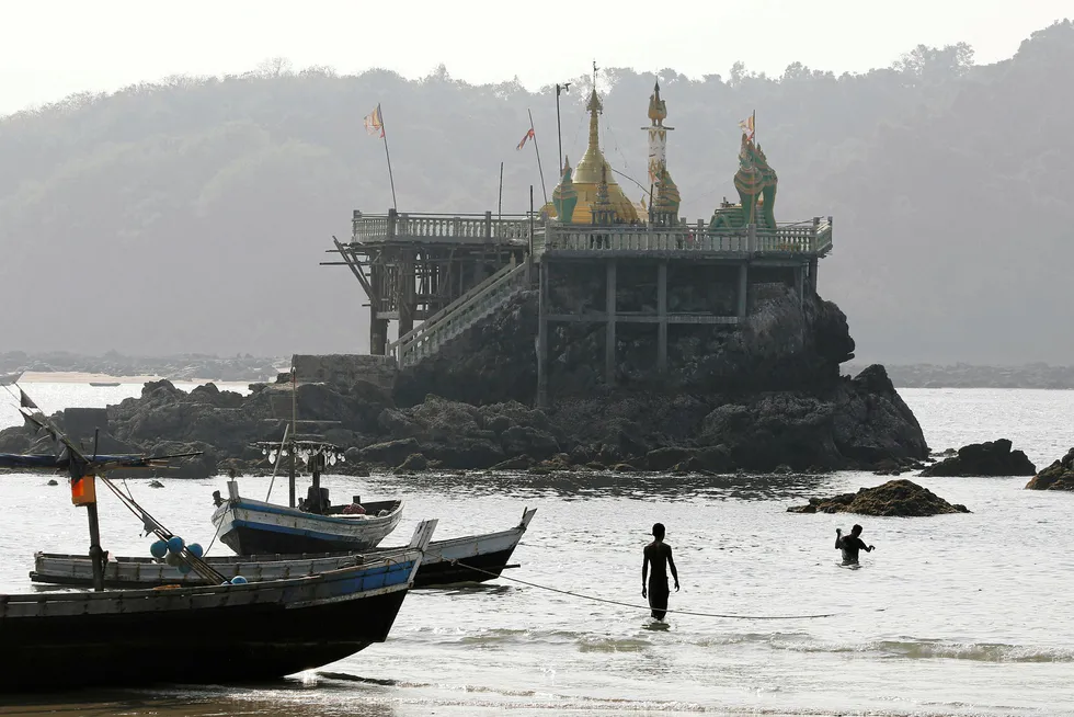 Casting the net: fishermen at Ngapali beach in Thandwe, Myanmar