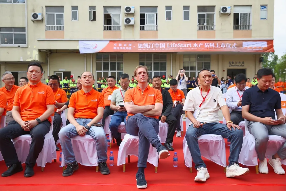 Nutreco China General Manager Jason Yang (left) and Skretting CEO Bastiaan van Tilburg (center) at the opening of Skretting's new production line in Zhuhai, southern China.