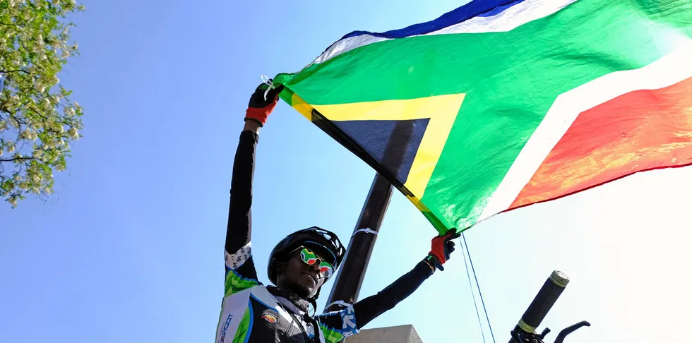 A rider waves the South African flag after a Heritage ride from Vilakazi Street on September 26, 2020 in Soweto South Africa.