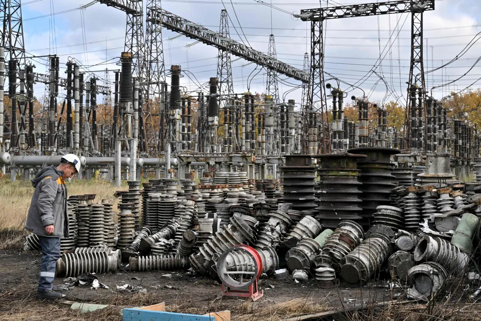 Assessment: a worker examines the aftermath of a Russian missile strike on a power plant in Ukraine.