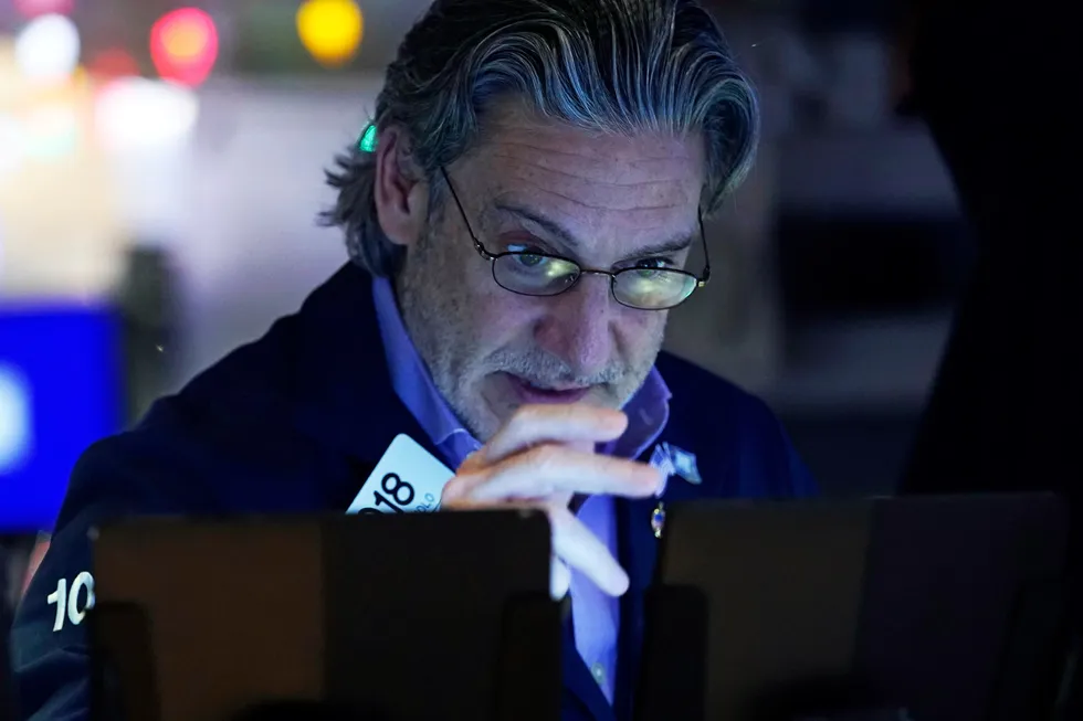 Trader John Romolo works on the floor of the New York Stock Exchange on Wednesday, 18 December 2024.