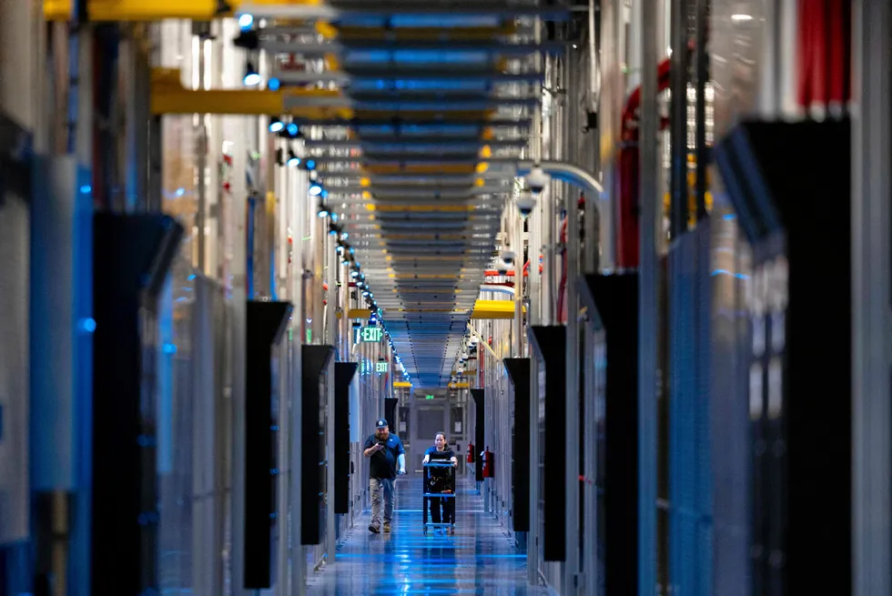 People walk through the hallways at Equinix Data Center in Ashburn, Virginia.