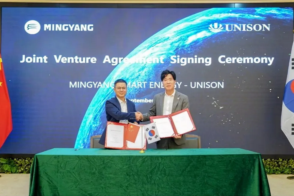 A signing ceremony for the joint venture partnership.