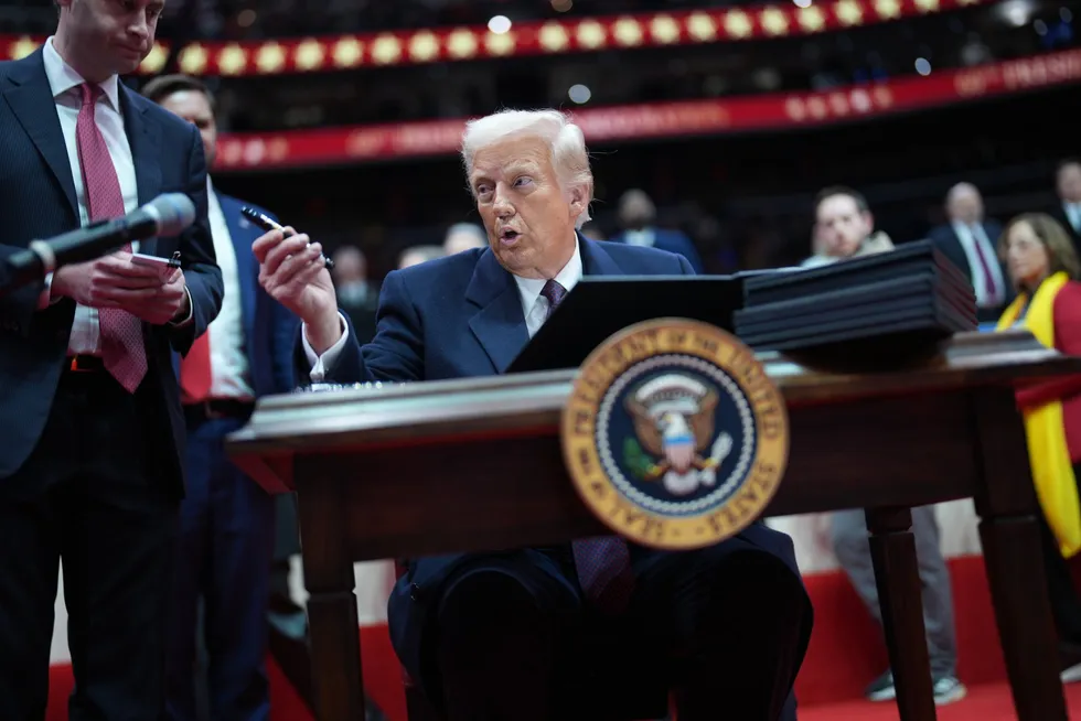 President Donald Trump signs executive orders during an event at Capital One Arena, part of the 60th inaugural ceremonies on January 20, 2025, in Washington, DC.