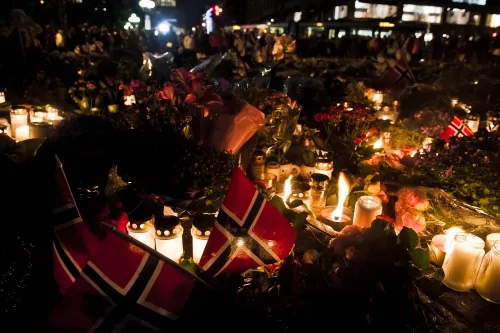 In mourning: a sea of flowers outside Oslo Cathedral has grown continuously since the attacks on Friday