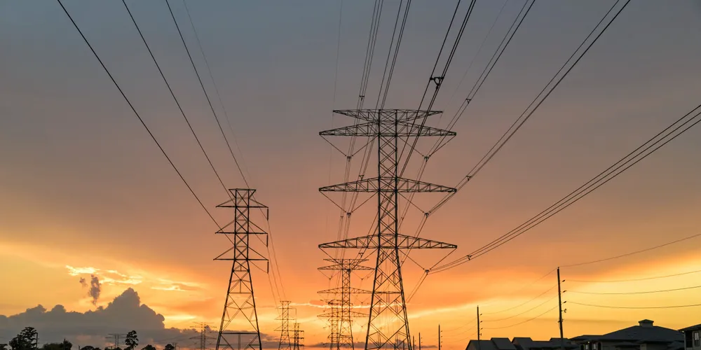 Transmission towers at sunset in Humble, Texas, US