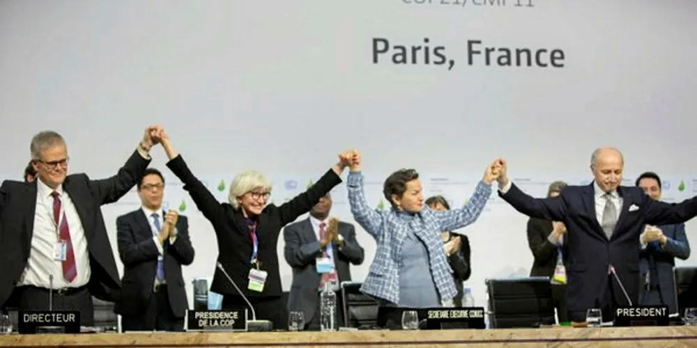 The top table at the COP21 summit celebrates the forging of the Paris Agreement