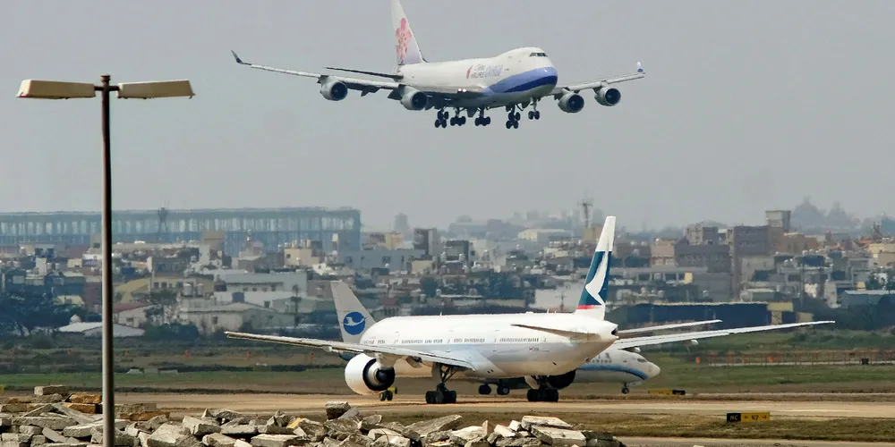 Aircraft landing at Taiwan's busy Taoyuan International Airport