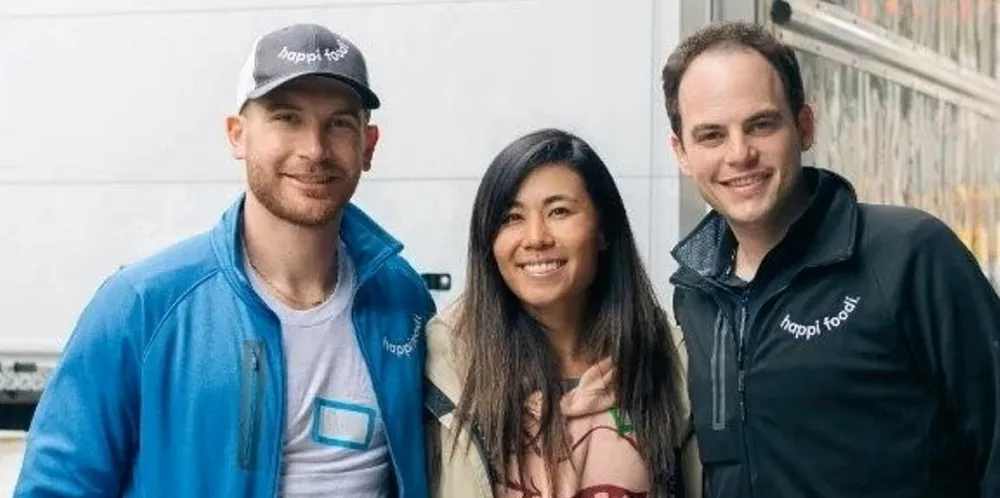 Happi Foodi co-founder Sam Rockwell, far left, and Justin Samuels, far right, with golf pro Danielle Kang in center. Kang has partnered with the group on charitable initiatives.