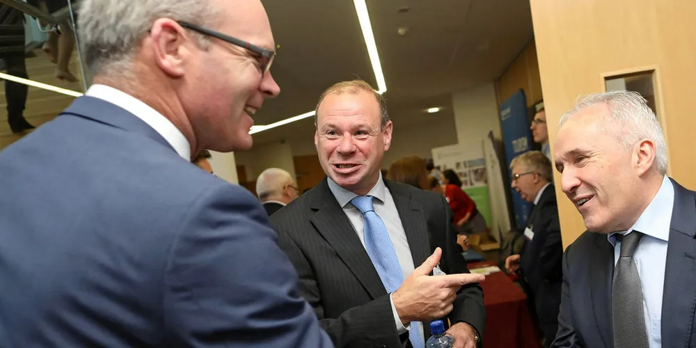 Richard Donnelly of BIM (center) with Irish Minister for Foreign Affairs and Minister for Defence Simon Coveney (left) and Andy Mulloy of Connemara Seafoods (right).
