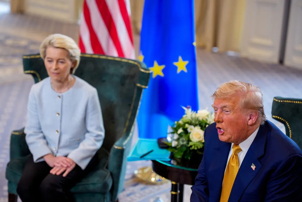 US President Donald Trump, accompanied by President of the European Commission Ursula von der Leyen (L), speaks during a meeting at Trump Turnberry golf club.