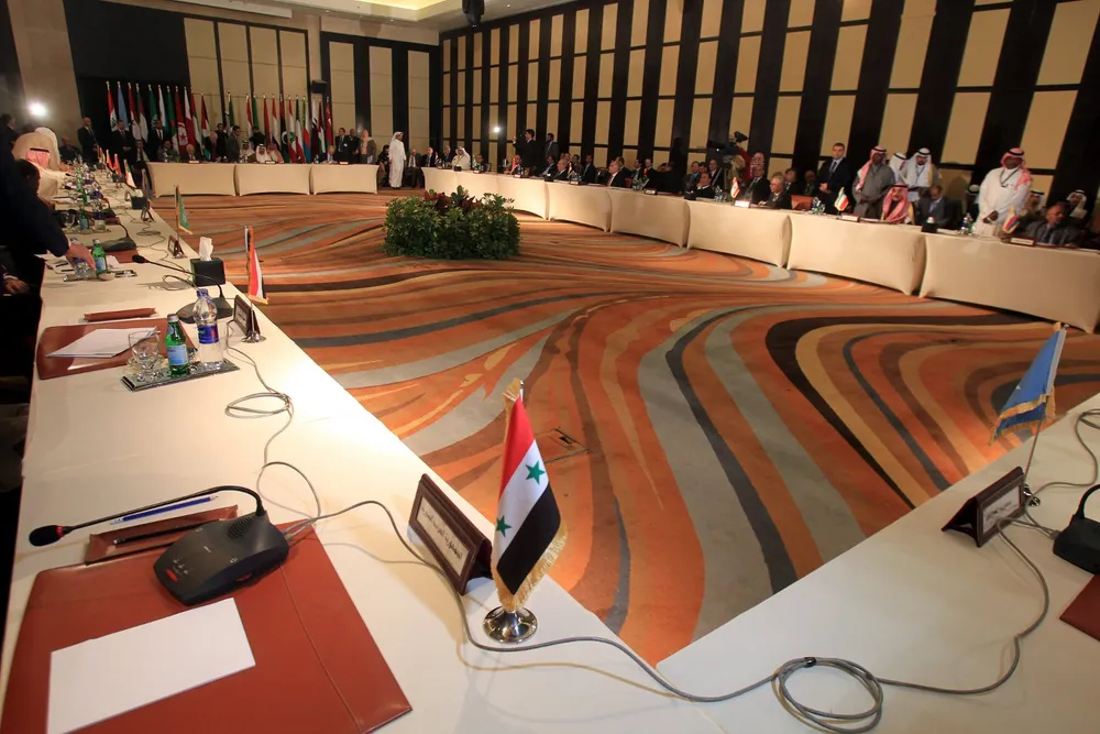 Vacant position: Syria has temporarily lost its seat at the Arab League table, above, while Kulczyk Oil is also sitting out the unrest in the Middle Eastern state