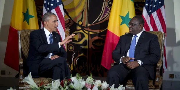 President Barack Obama talks to counterpart Macky Sall during a 2013 visit to Senegal.