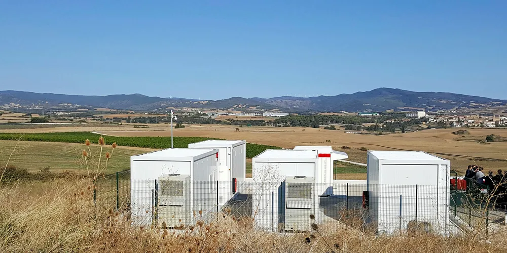 An Acciona battery storage facility adjacent to a wind farm in Spain
