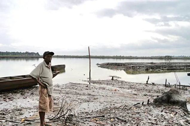 Lost livelihoods: Bodo resident John Sunday Belbari standing on the spot that used to be his fishponds