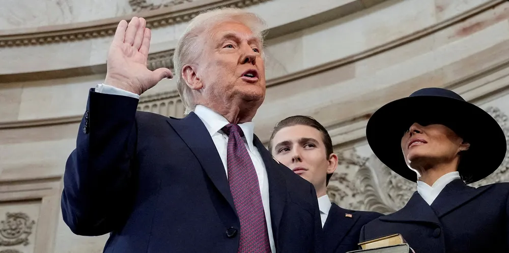 Donald Trump is sworn in as the 47th President of the US by chief justice John Roberts as Melania Trump holds the Bible.