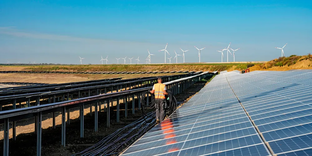 RWE solar array on with wind farm in background