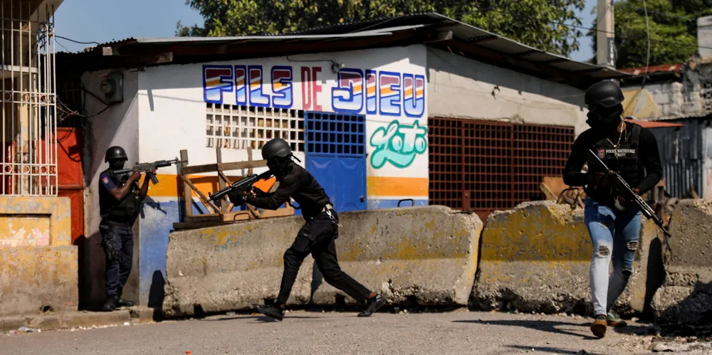 Police officers take part in an operation following an outbreak of gang violence in Haiti.