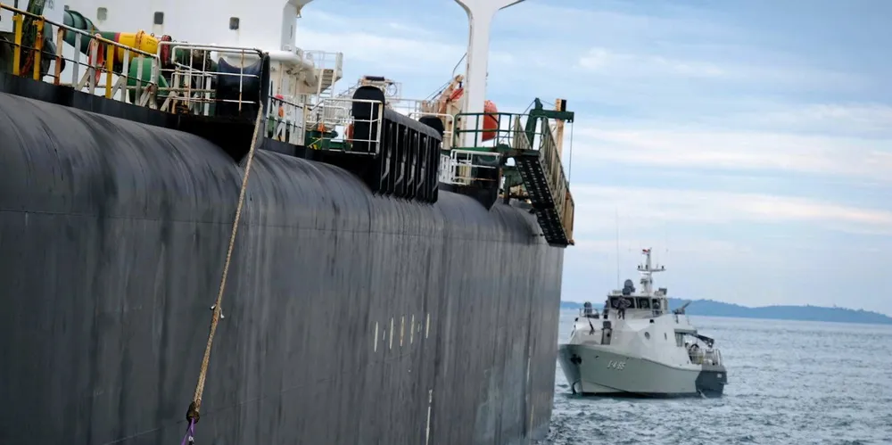 An Indonesian Navy vessel comes alongside the VLCC Young Yong (renamed Stellar Oracle) aground off Indonesia in 2022.