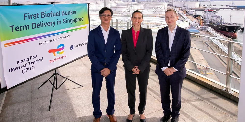 (From left) Jurong Port Universal Terminal CEO Loh Wei, TotalEnergies Marine Fuels vice president Louise Tricoire and Hapag-Lloyd director of global fuel purchasing Lukas Gaus celebrate the start in February of a first biofuel term delivery to one of Hapag-Lloyd’s container ships in Singapore.