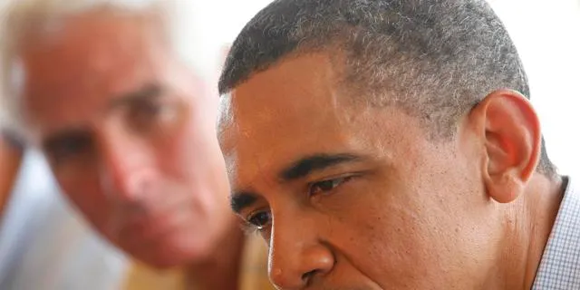 President Barack Obama, accompanied by Florida Governer Charlie Crist, left, makes a statement after he meets with local officials on Pensacola Beach