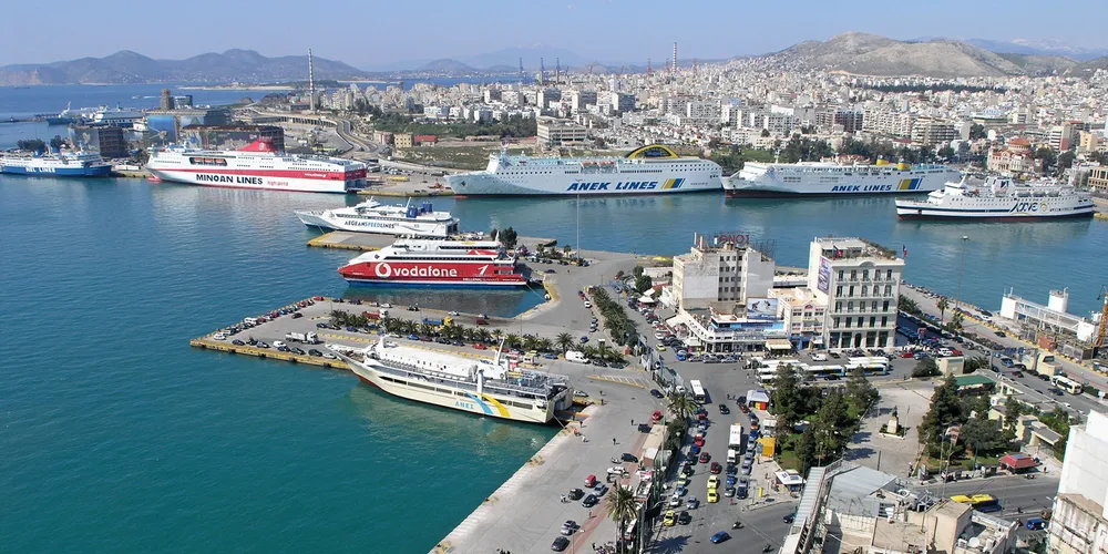 ANEK Lines and Attica Group ferries are seen anchored side-by-side in the Piraeus passenger ship terminal.