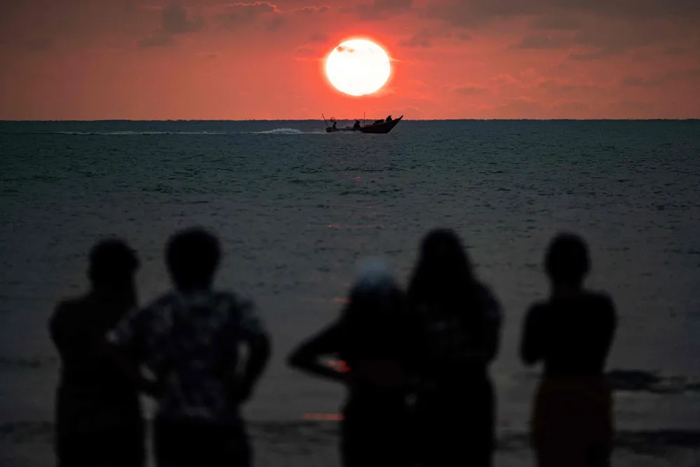 Sunrise at Teluk Cempedak Beach in Kuantan, Malaysia.