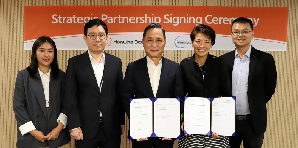 (From left) Hanwha Ocean principal researcher for the technology team Jung Yeon Lee, team leader of the commercial vessel development team Jong Ki Lim and chief technical officer Young Chang (James) Shon sign show off the new agreement with GCMD chief executive Lynn Loo and partnership director Lau Wei Jie.