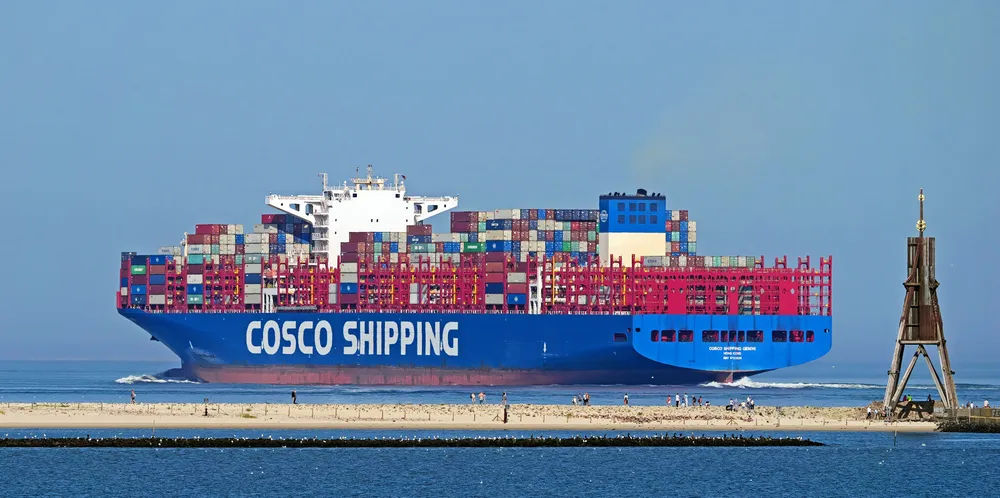 A Cosco Shipping Lines containership sails off Cuxhaven.