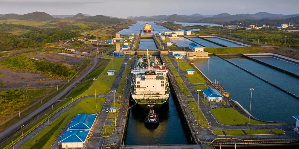 Two ships transit the Cocoli Locks on the Panama Canal.