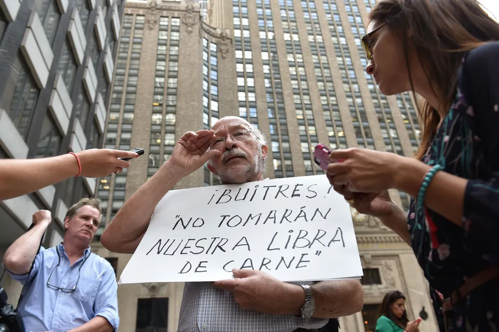 Argentina default: Protestor rails against hedge funds suing country's government