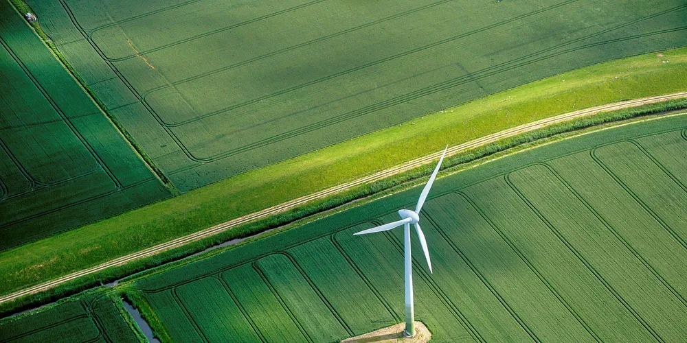A wind turbine stands in a field near Hamburg, Germany