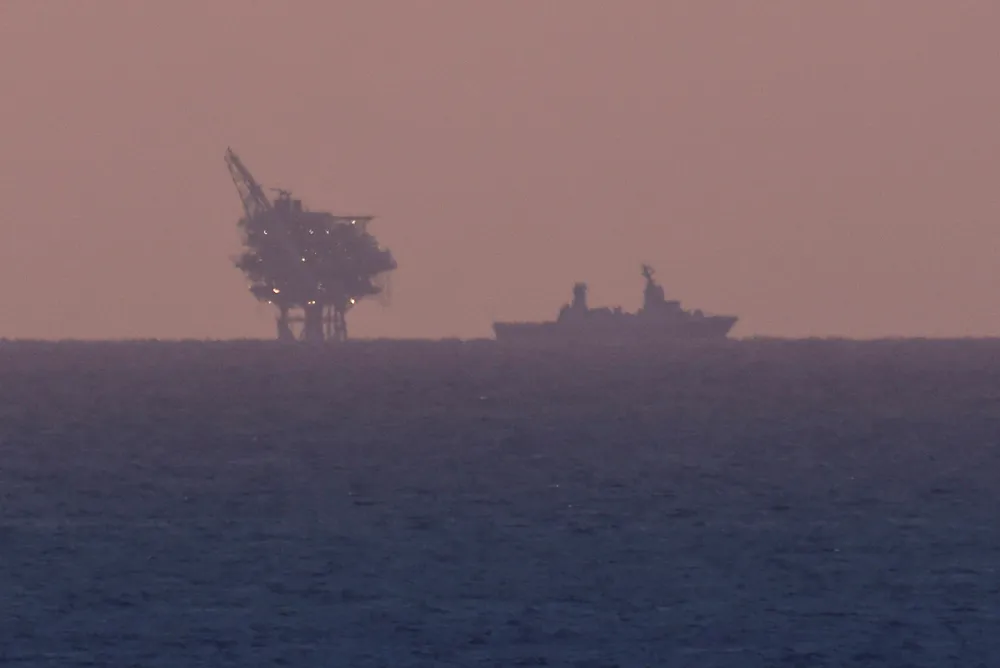 Threat: Chevron’s Leviathan gas platform offshore Israel as an Israeli Navy vessel patrols the Mediterranean Sea off Ashkelon, close to Gaza on 14 November.