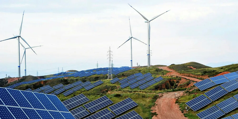 Solar panels and wind turbines in Hebei province, China.