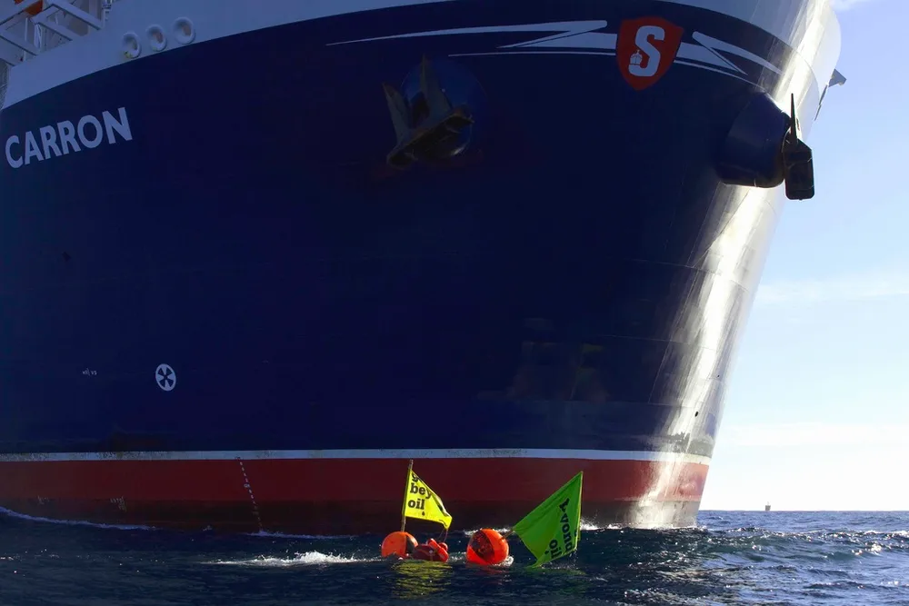 new action: Greenepace protesters,. photographed yesterday, swim in front of the Stena Carron in an attempt to halt the vessel's progress to Lagavulin