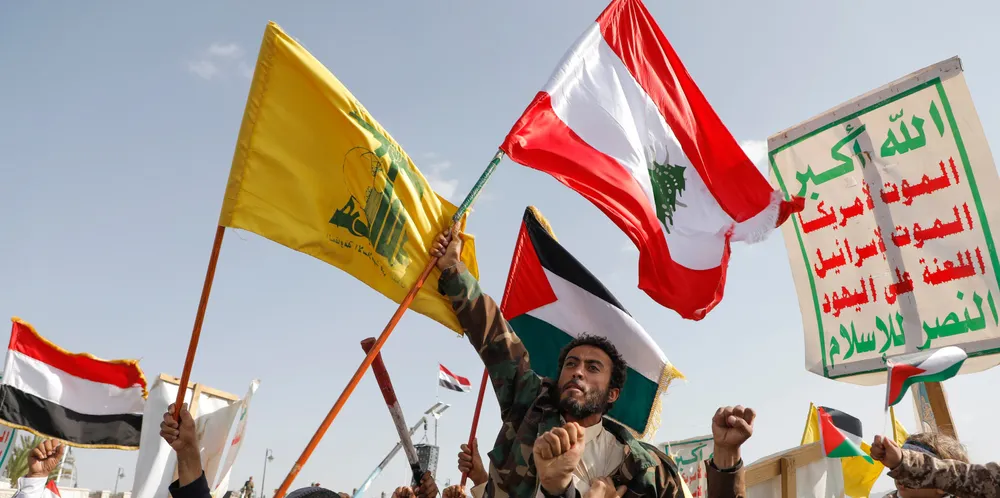 Houthi supporters raise a Lebanese flag during at anti-Israel and anti-US rally in Sanaa, Yemen, on Friday.