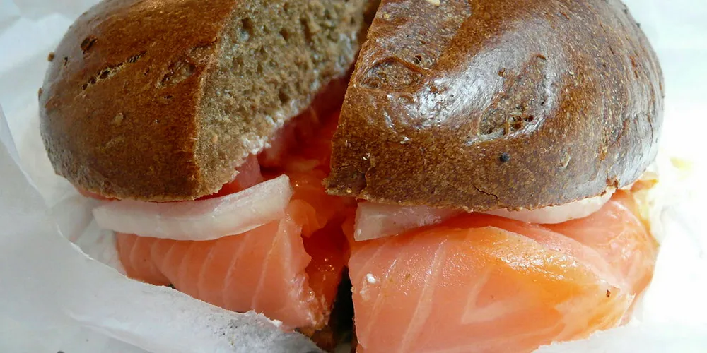 Bagel and salmon lox, together.
