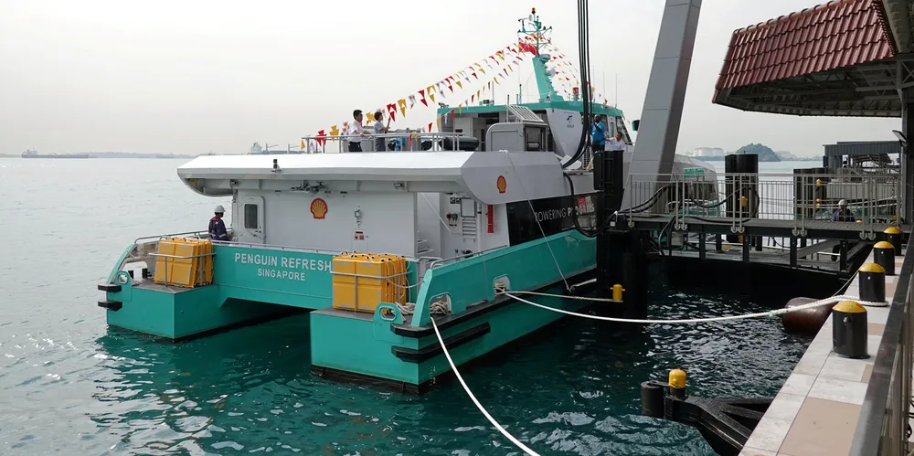 Penguin International's electric ferry Penguin Refresh powers up at the Shell ferry terminal on Pulau Bukom.