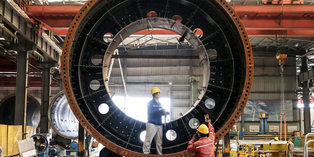 China says its manufacturing sector grew by 3.3% in the first three months.