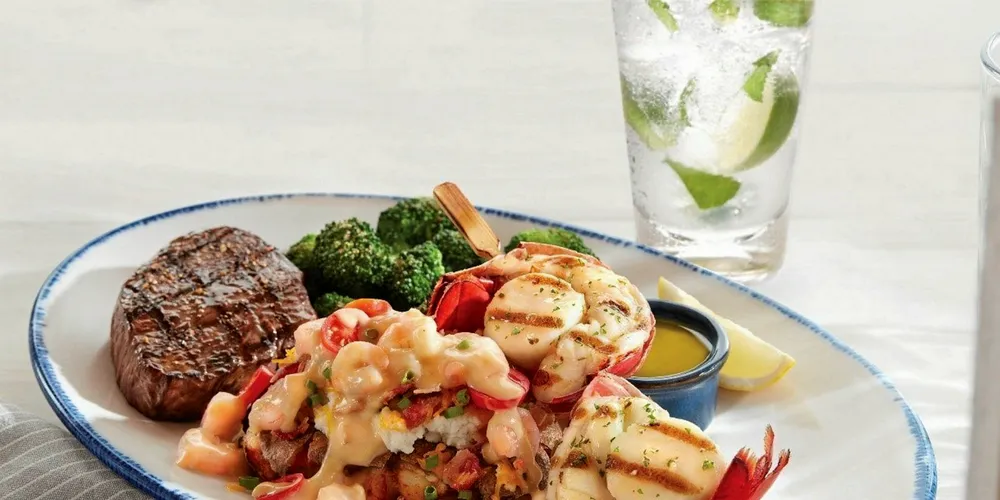 Red Lobster is offering the best of land and sea with its new Surf & Turf Feast, featuring a grilled Maine lobster and sea scallops skewer, paired with a choice of wood-grilled top sirloin, filet or New York strip steak and a Norway lobster-and-shrimp loaded smashed potato.