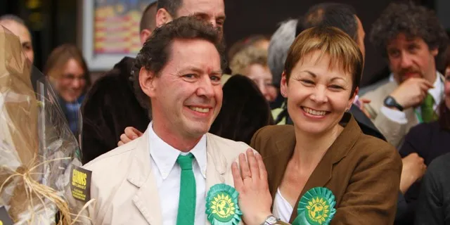 Caroline Lucas celebrates with her husband Richard Savage and party activists outside the Brighton Centre, after she became Britain's first Green Party MP
