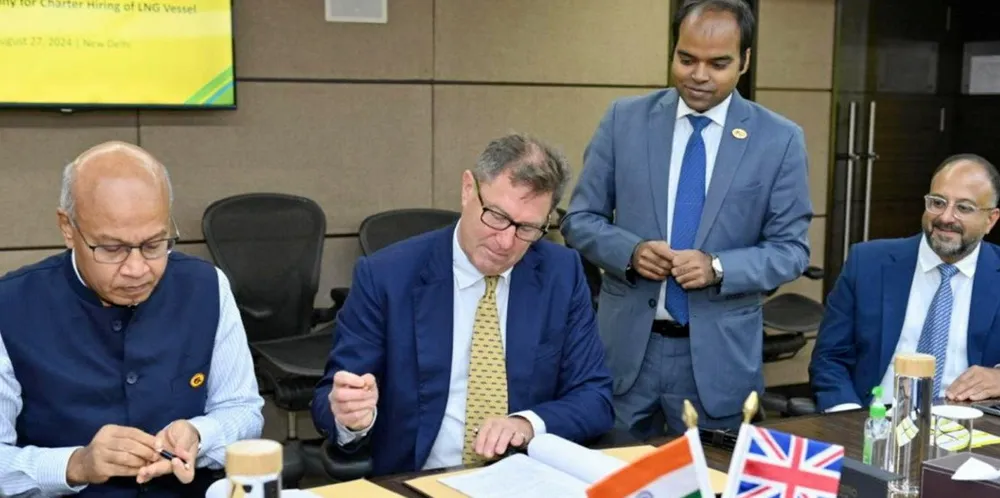 Gail executive director of shipping and international LNG S Bairagi (left) inked the charter hire agreement with Shell LNG marketing and trading team leader Richard Dickins (centre).