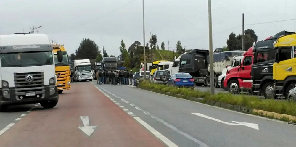 Protestors block the road in Quellon, Chile.