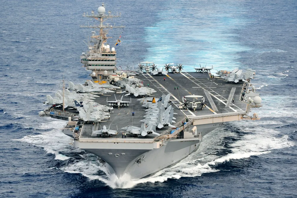 Plain sailing: THe USS Abraham Lincoln entered the Strait of Hormuz without incident.