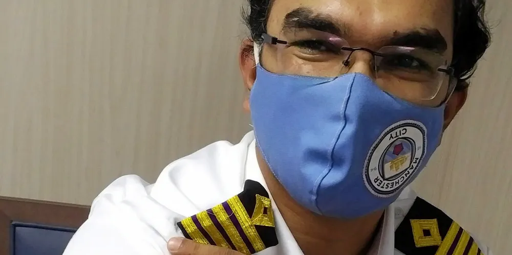 Seafarer relaxes after on-board vaccination in the US.