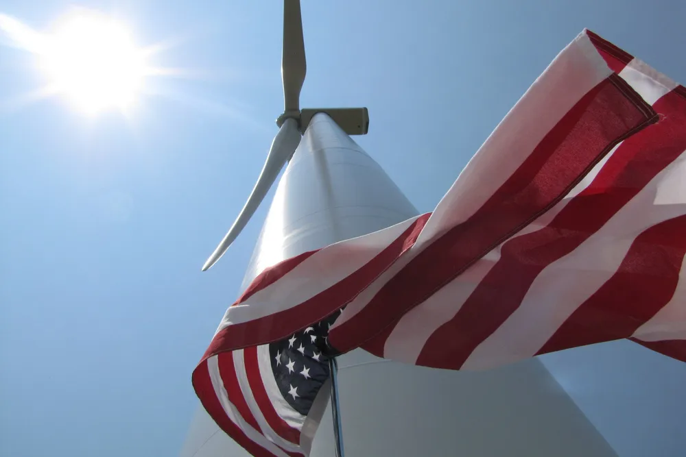 US flag and wind turbine in Iowa
