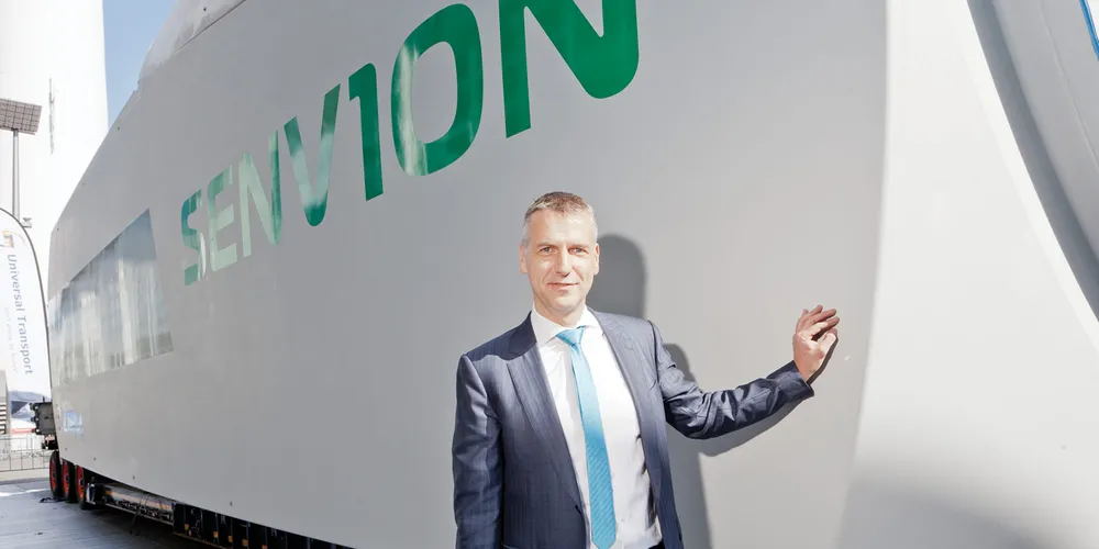 Andreas Nauen in front of the Senvion nacelle outside WindEnergy Hamburg