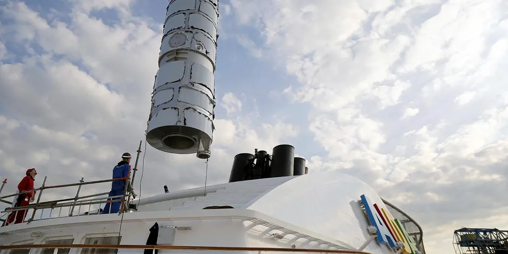 An exhaust gas scrubber is installed on a cruise ship.